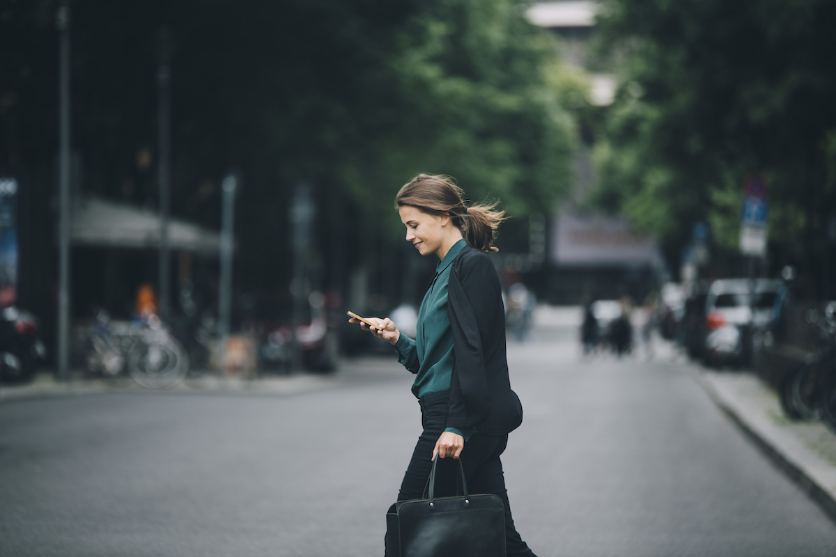 professional walking across the road